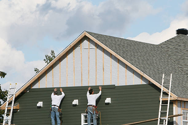 Professional Siding technician working in Oceanside, NY